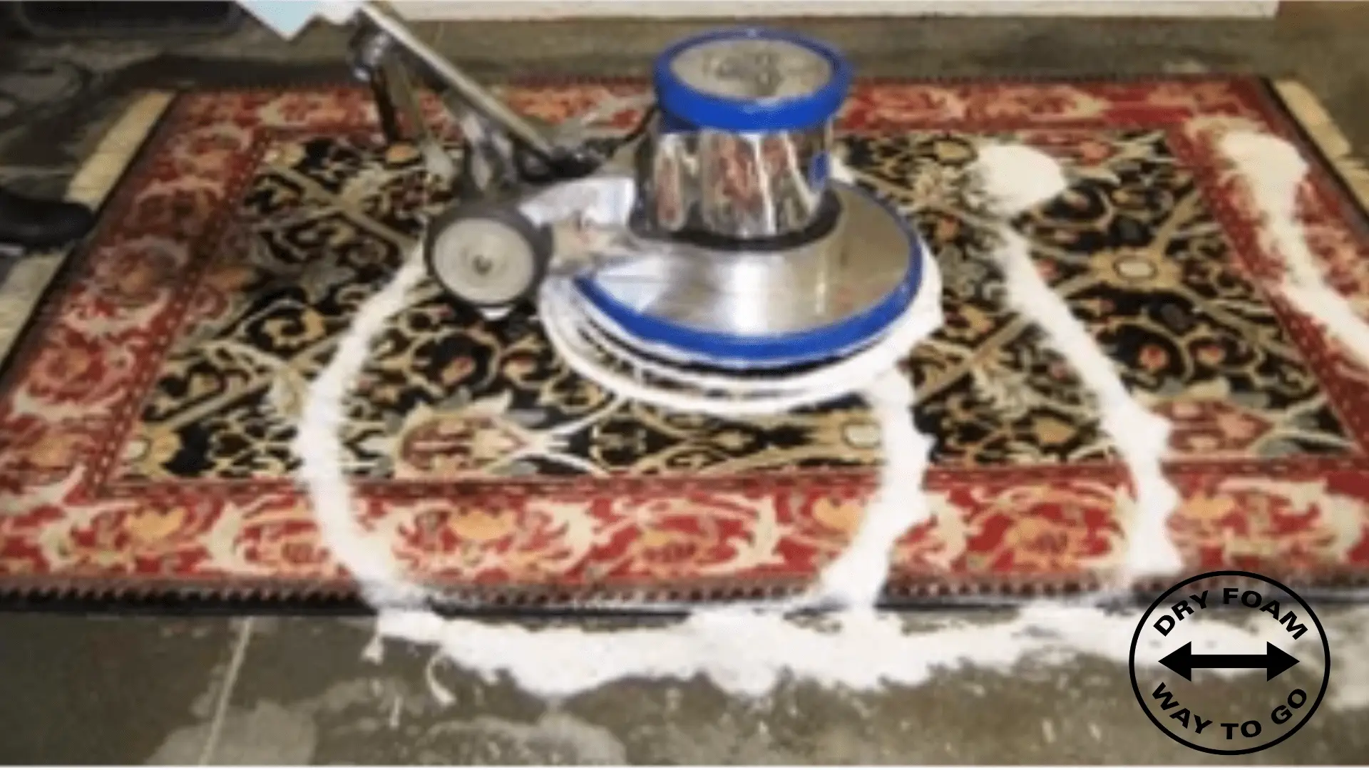 A carpet cleaning machine on top of a rug.